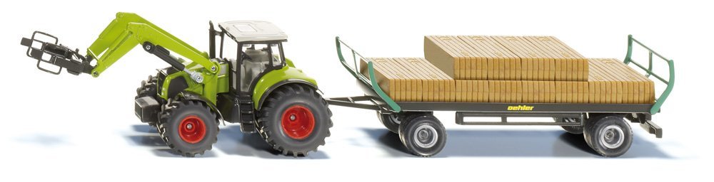 Tractor met rechthoekige balengrijper en aanhangwagen