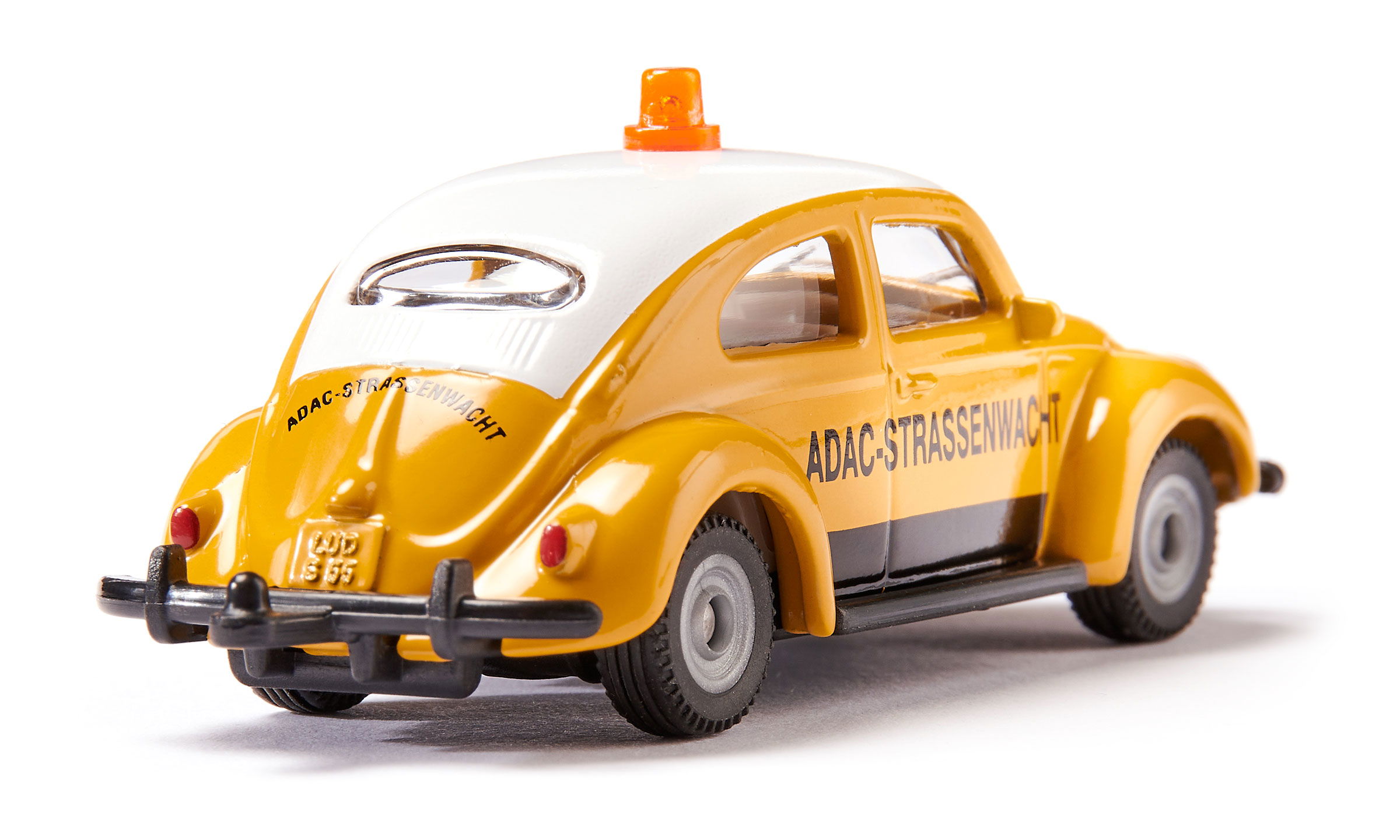 VW Käfer in gelb mit ADAC-Strassenwacht Druck, schräg von hinten fotografiert  – Klassiker mit Nostalgie-Faktor, ideal zum Spielen oder Sammeln.